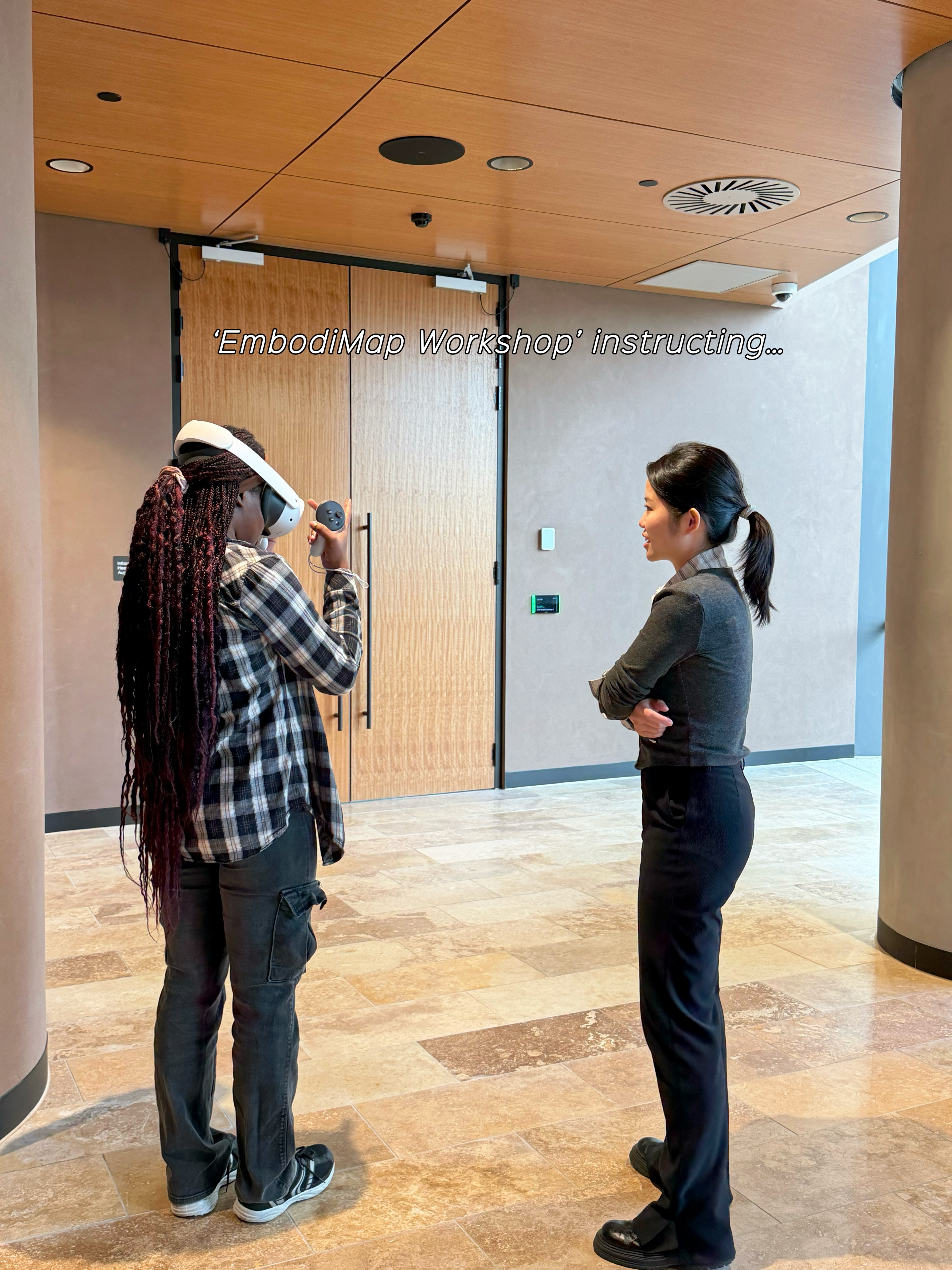 Audrey instructing a participant wearing a VR headset